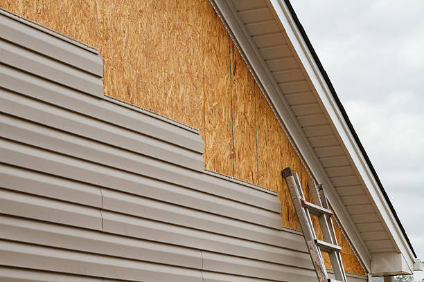 Professional Emergency Siding Repair technician working in Dry Ridge, OH